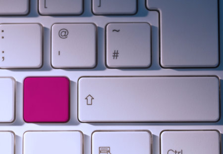 Digital composite of Pink key on keyboard