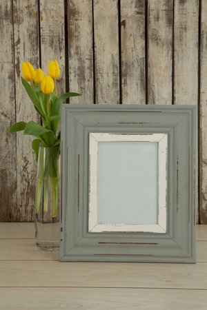 Photo frame and flower on table, Close-up