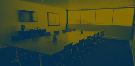 Table and chairs in arranged modern officeの写真素材