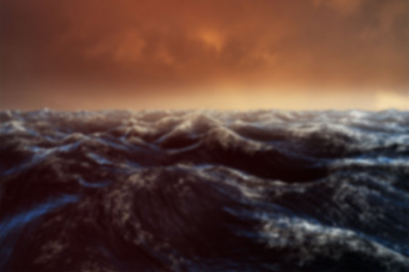 Waves in sea against sky during sunsetの写真素材