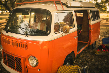 Orange caravan parked at campsiteの写真素材