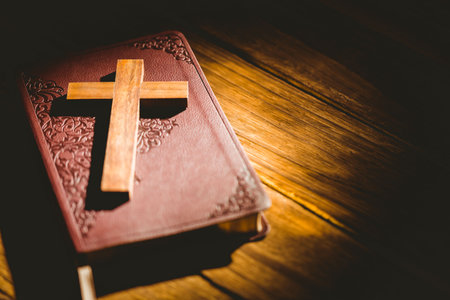 High angle view of wooden cross on bibleの写真素材