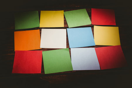 High angle view of colorful papers on wooden floor