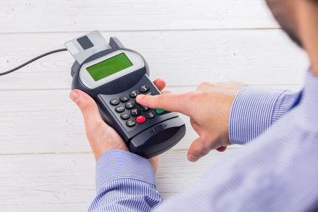 Man paying with credit cardの写真素材