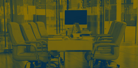 Personal computers on desk in officeの写真素材