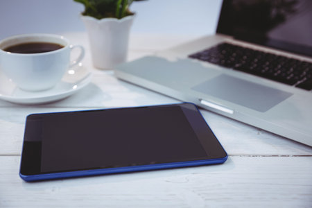 Desk with laptop and tabletの写真素材
