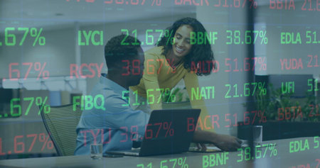 Colleagues in formal wear reviewing stock ticker symbols in boardroom with laptop and partitions. Business, teamwork, modern, professional, data, collaboration, analyticsの写真素材