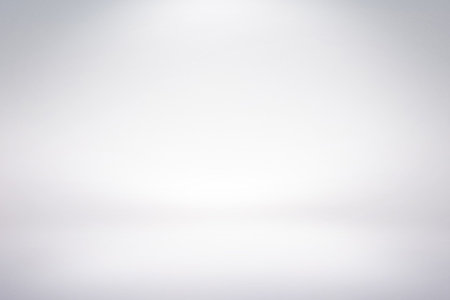 Backdrop is showing seamless white-to-light-gray gradient, giving neutral minimal space for layouts. Minimalist, modern, neutral, versatile, background, design, cleanの写真素材