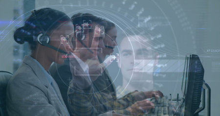 Reaching African American woman hovering over monitor at office, headsets, HUD overlays, copy space. Technology, collaboration, digital, innovation, futuristic, workplace, dataの写真素材