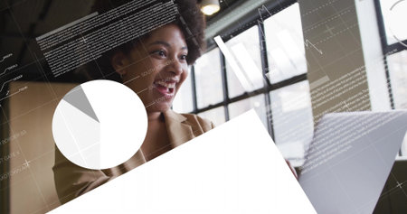 Analyzing woman wearing blazer reviewing overlays at office desk with laptop, pie chart, copy space. Professional, data, technology, innovation, analytics, workspace, modernの写真素材