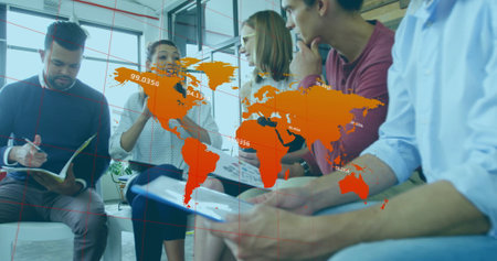 Collaborating group of five colleagues in office meeting corner, with charts and world map overlay....