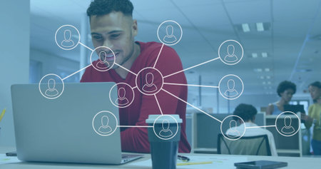 Man working on laptop with network connections image overlay in office. Technology, digital,...