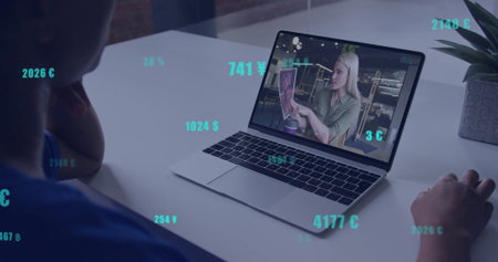 Watching image of floating currency symbols, person on image call with laptop. Finance, virtual communication, technology, investment, remote work, globalizationの写真素材