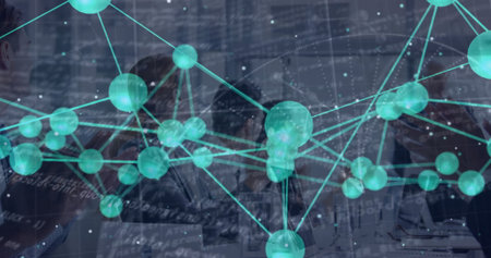 Displaying network overlay sweeping across table in conference room, with team using laptops....