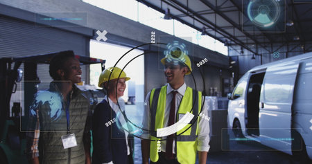 Team in hard hats and vest touring loading bay inside warehouse, with forklift and pallets. Industrial, logistics, safety, teamwork, efficiency, construction, managementの写真素材