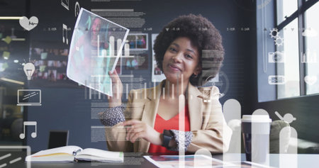 Pointing woman in beige blazer showing printed report pages at office, with digital data overlay. Corporate, technology, teamwork, analytics, modern, professional, innovationの写真素材