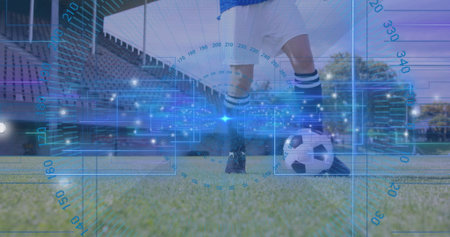 Positioning female player wearing white kit placing foot on ball at stadium pitch, with digital HUD....