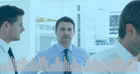 Discussing business, professionals analyzing bar graph image in office setting. analysis, teamwork,...