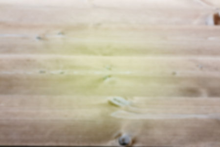 Flat design wood texture is showing blurred horizontal plank pattern with light tan highlights. Texture, natural, organic, rustic, minimalist, background, surfaceの写真素材