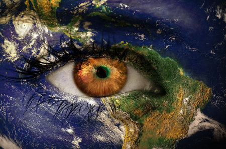 Eyelashes are casting shadows on satellite Earth map in surreal digital design with clouds. Fantasy, globe, cosmos, abstract, visionary, environmental, celestialの写真素材