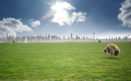 Rounded canopy tree is standing in flat design grass field featuring skyline wind turbines and sun. Nature, landscape, sustainability, eco-friendly, outdoor, modern, serenityの写真素材