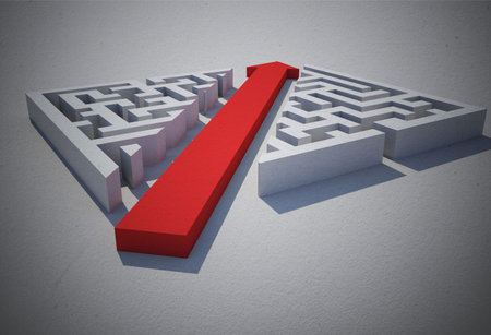 Red arrow cutting through puzzleの写真素材