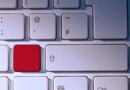 Digital composite of Red key on keyboardの写真素材
