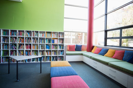 Colorful modular bench is anchoring flat design library corner, with bookshelf and cushions....
