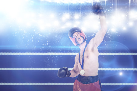 Digital composite image of shirtless boxer shouting in ringの写真素材