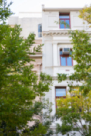 Low angle view of building with trees on foregroundの写真素材