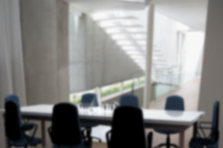 Composite image of chairs and table in office