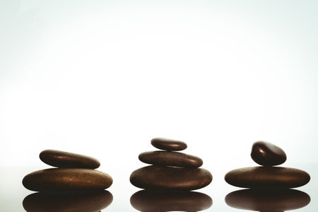 Zen stones balancing on white backgroundの写真素材