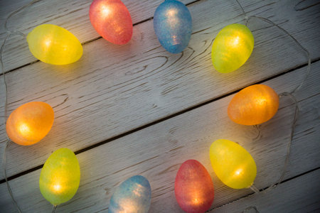 Overhead view of illuminated lights on wooden planks during Easterの写真素材