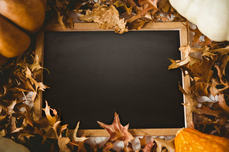 Black screen surrounded by brown leafの写真素材