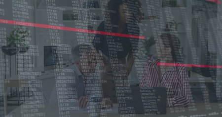 Collaborating office professionals reviewing code overlay in modern office, with laptops and plant. Teamwork, innovation, technology, workspace, productivity, modern design, communicationの写真素材