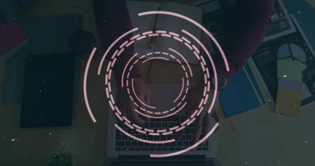Circular digital interface image over person typing on laptop at desk. Technology, futuristic, innovation, workplace, interaction, cyberの写真素材