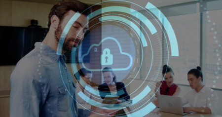 Bearded man checking smartphone in conference room, with laptop and cloud padlock overlay. Technology, teamwork, professionalism, innovation, data security, collaboration, modernityの写真素材
