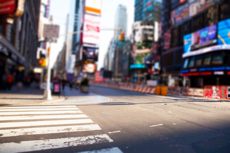 Flat design zebra crosswalk is dominating city intersection, showing traffic lights and billboards. Urban, modern, minimalist, metropolitan, cityscape, architectural, commercialの写真素材