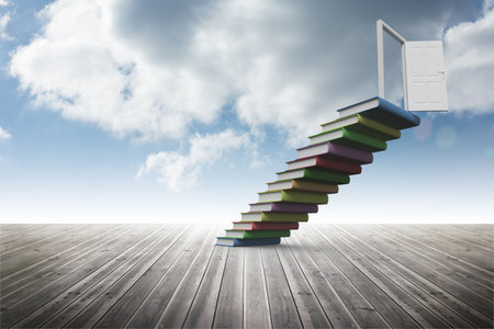 Book steps leading to door against skyの写真素材