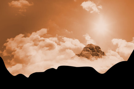 Mountain summit is rising above dense cloud layer in sepia-toned flat design, showing bright sun. Adventure, exploration, tranquility, elevation, serenity, wilderness, majestyの写真素材