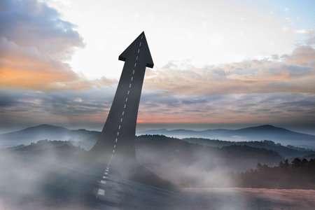 Surreal flat design is showing arrow-shaped road with dashed line ascending misty mountain ridge. Abstract, nature, adventure, landscape, transportation, inspirational, minimalistの写真素材