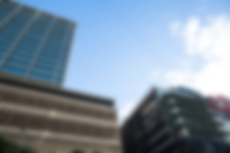 Defocused image of buildings against sky in city