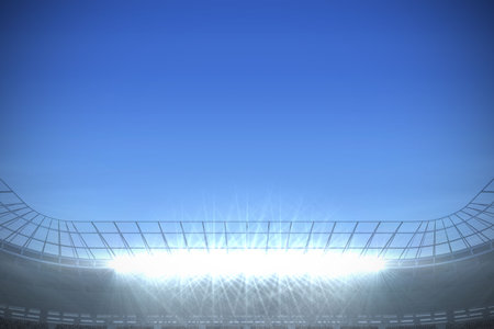Digitally generated large football stadium with spotlights under bright blueの写真素材