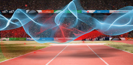 Red and blue trails over playing field in stadiumの写真素材