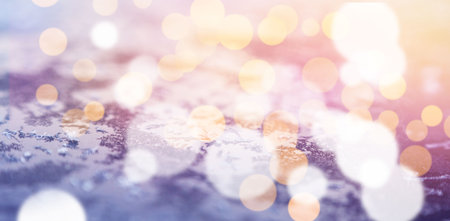 Close-up of defocused lights against snow covered land