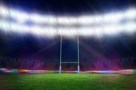 White goalposts with blue padding are standing under bright floodlights in flat design, copy space. Stadium, outdoor, sports, illumination, nighttime, wet, arenaの写真素材