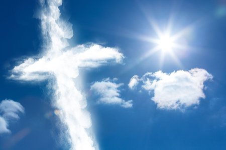 Cross shaped cloud formation is floating in flat design sky with sun rays and lens flare. Heavenly, celestial, serene, minimalist, inspirational, nature, atmosphericの写真素材