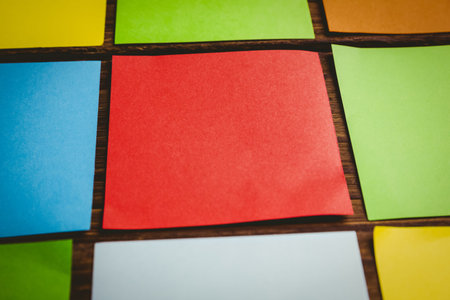 Close-up of colorful papers arranged side by side on floor
