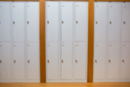 Closed white lockers in room at university
