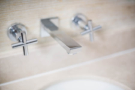 Close-up of modern faucet in bathroomの写真素材